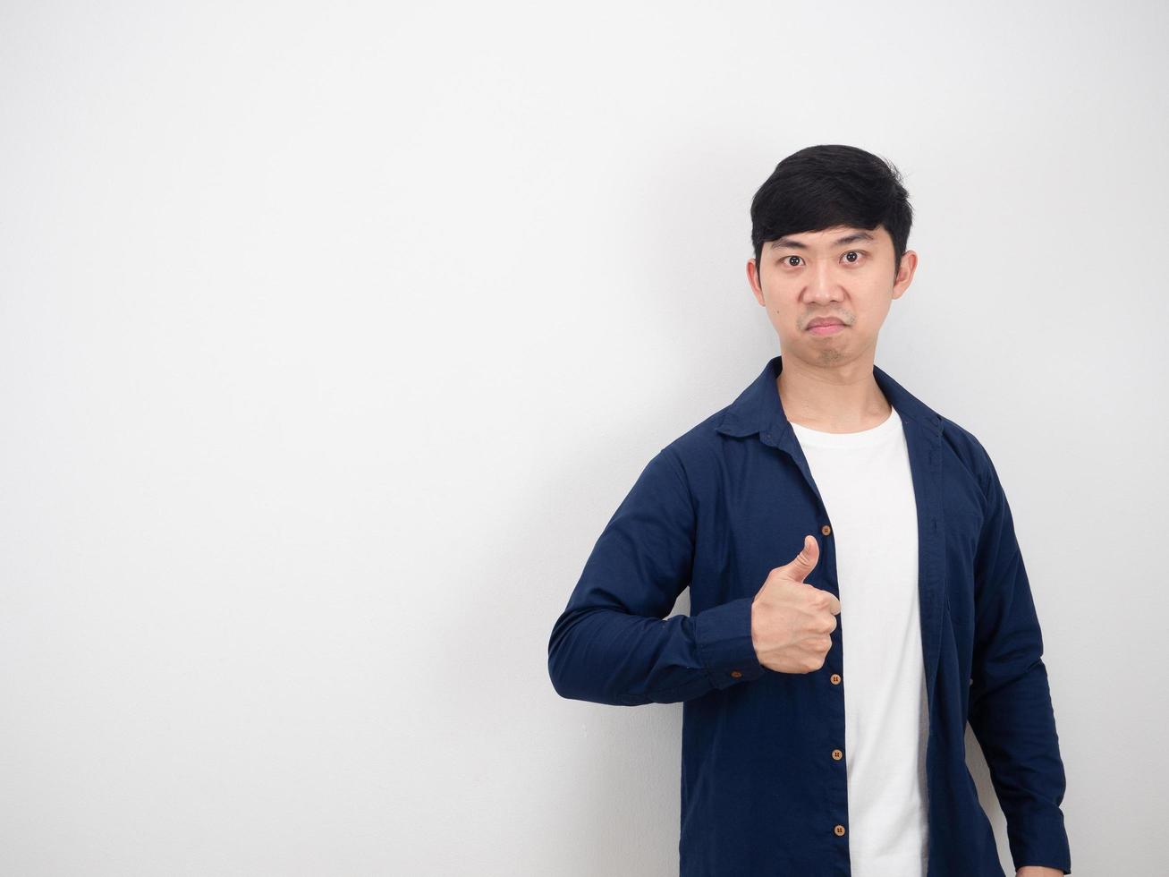 Asian man confident face show thumb up on white background photo