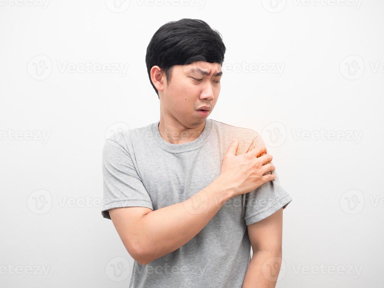 Man grey shirt gesture pain his shoulder white background photo