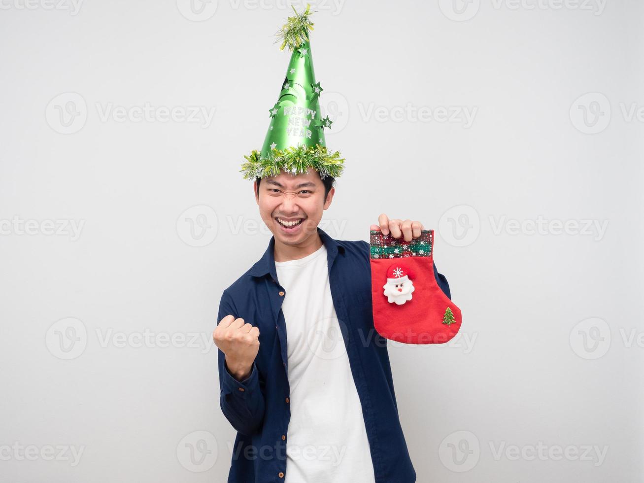 Man holding christmas stocking and show fist up for celebration merry christmas concept photo