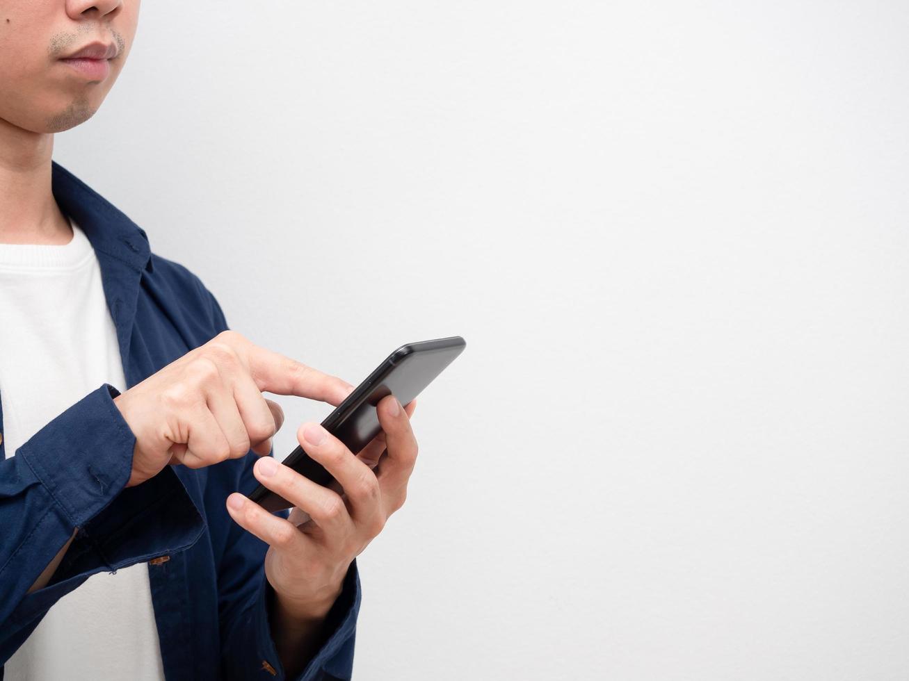 Closeup man using smartphone for shopping look at copy space white background photo