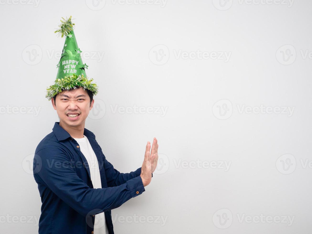 Man with happy new year hat gesture push hand copy space photo