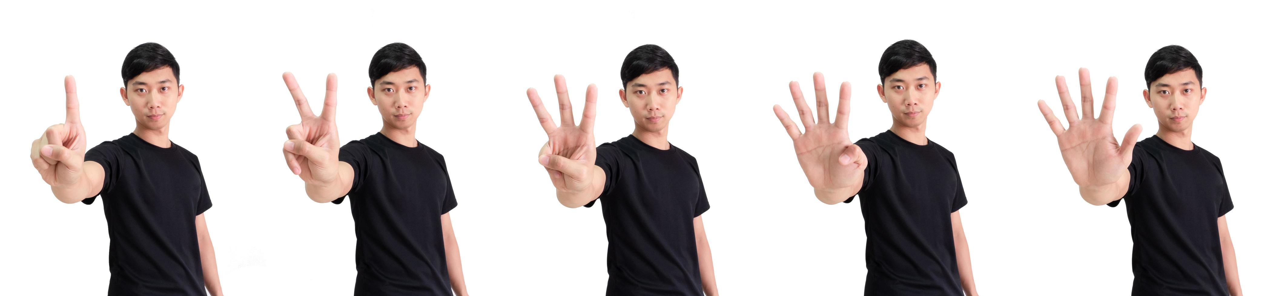 Young Asian man count one to five by hand half body on white isolated background,Man black shirt counting number concept photo