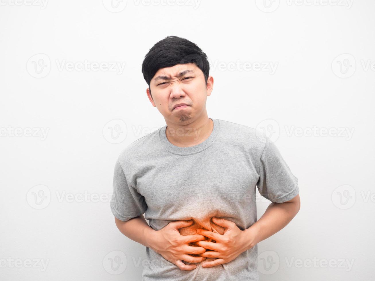 Man grey shirt gesture stomach ache feeling unhappy photo