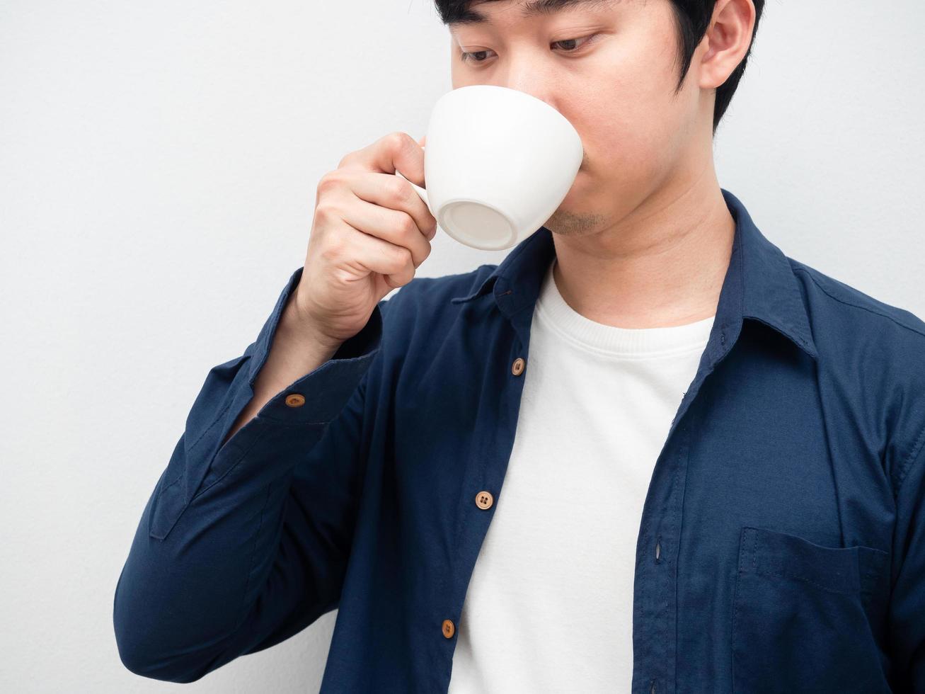 Closeup asian man drinking coffee cup portrait white background photo