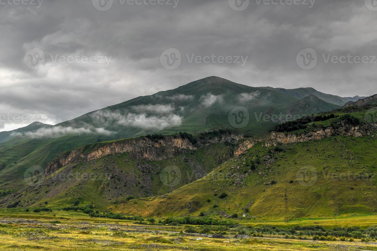 Hilly landscape near the village of Gergeti in Georgia, under Mount Kazbegi. photo