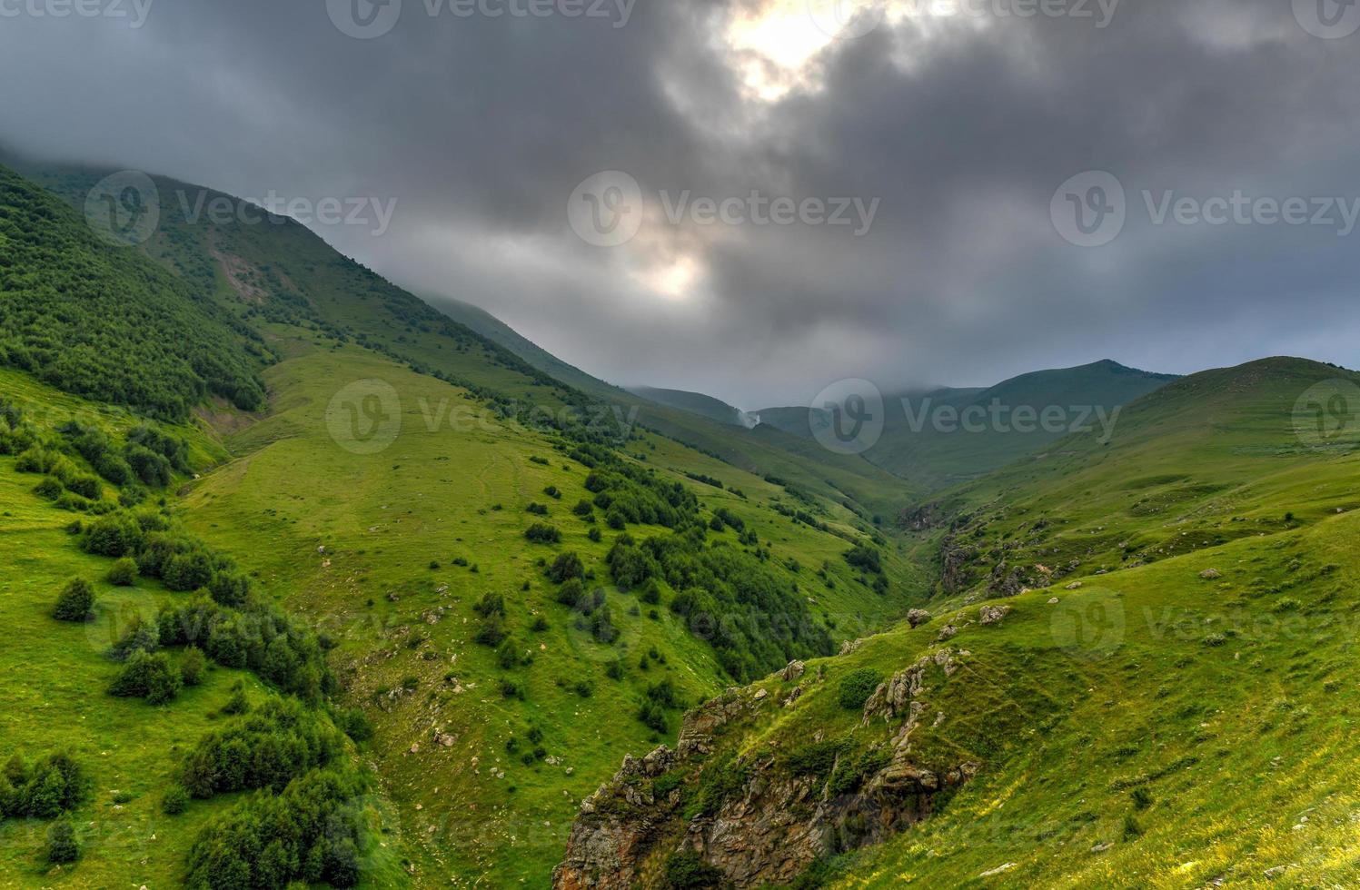Hilly landscape near the village of Gergeti in Georgia, under Mount Kazbegi. photo