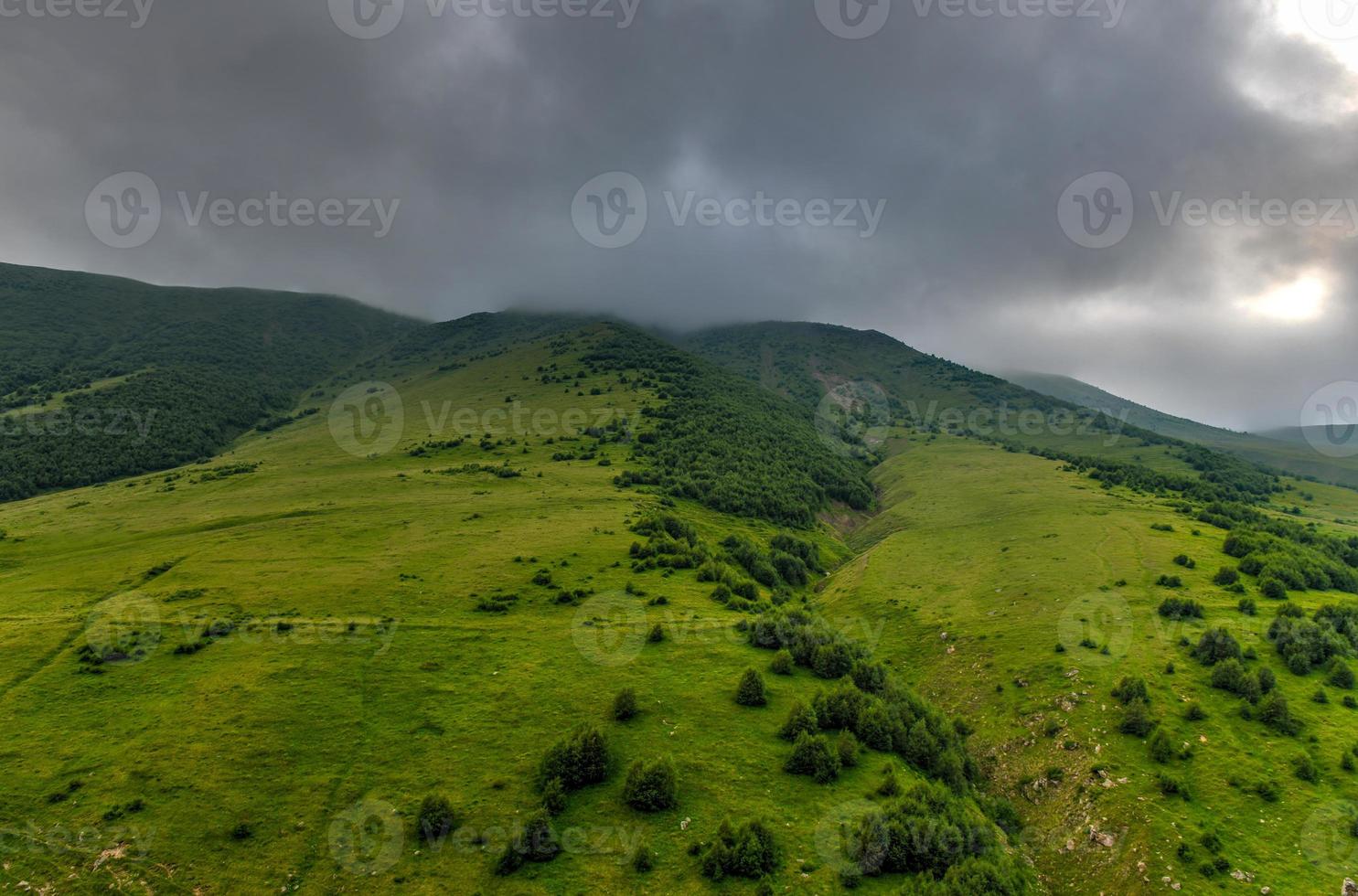 Hilly landscape near the village of Gergeti in Georgia, under Mount Kazbegi. photo