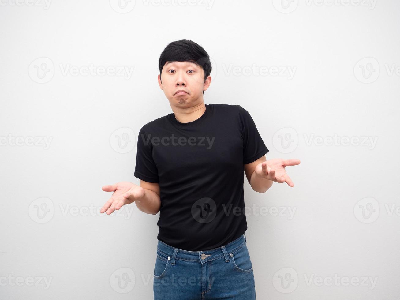 Asian man black shirt hand up gesture up to you photo