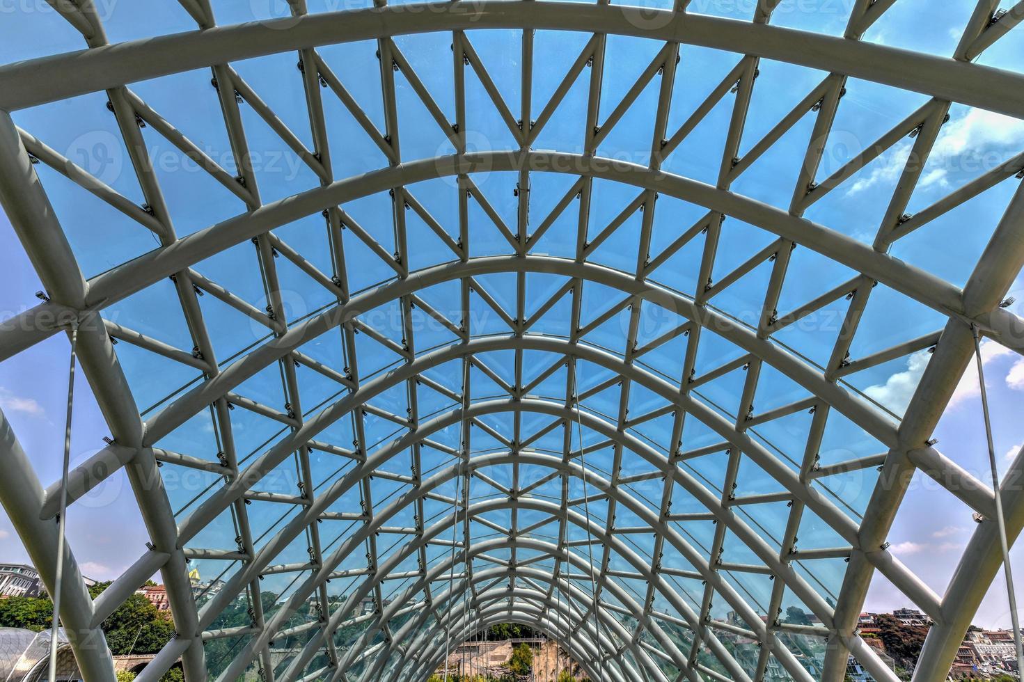 The Bridge of Peace in Tbilisi, a pedestrian bridge over the Mtkvari River in Tbilisi, Georgia. photo