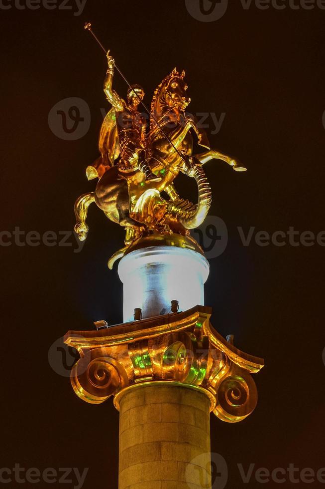 Golden statue of St. George on the main square of Tbilisi, capital city of Georgia. photo