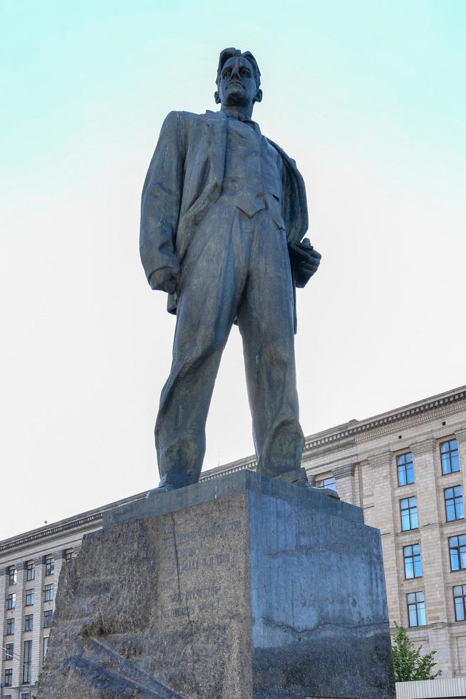 Monument to the Soviet poet Vladimir Mayakovsky on Triumph Square near Tverskaya street in Moscow, Russia. It was erected in 1958. Beautiful view of old architecture in Moscow centre in summer, 2022 photo