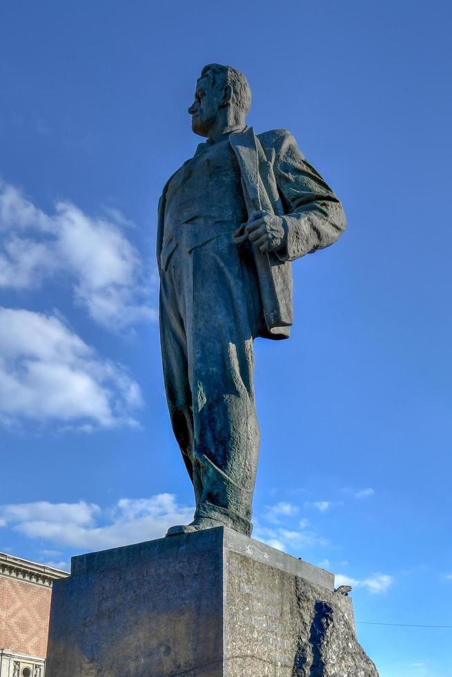Monument to the Soviet poet Vladimir Mayakovsky on Triumph Square near Tverskaya street in Moscow, Russia. It was erected in 1958. Beautiful view of old architecture in Moscow centre in summer, 2022 photo