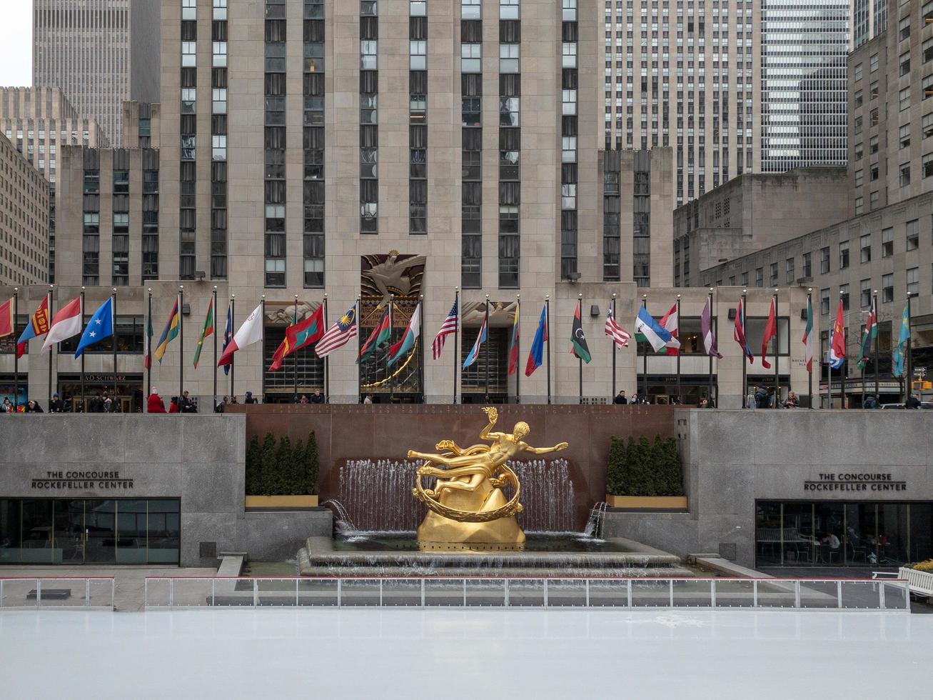 New York City - February 27, 2019 -  Prometheus Statue at Rockefeller Center in New York City in the winter with the ice skating rink. photo