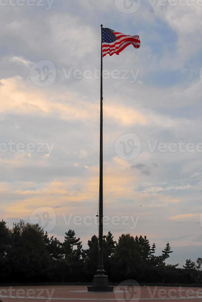 USA Flag over Liberty Island photo