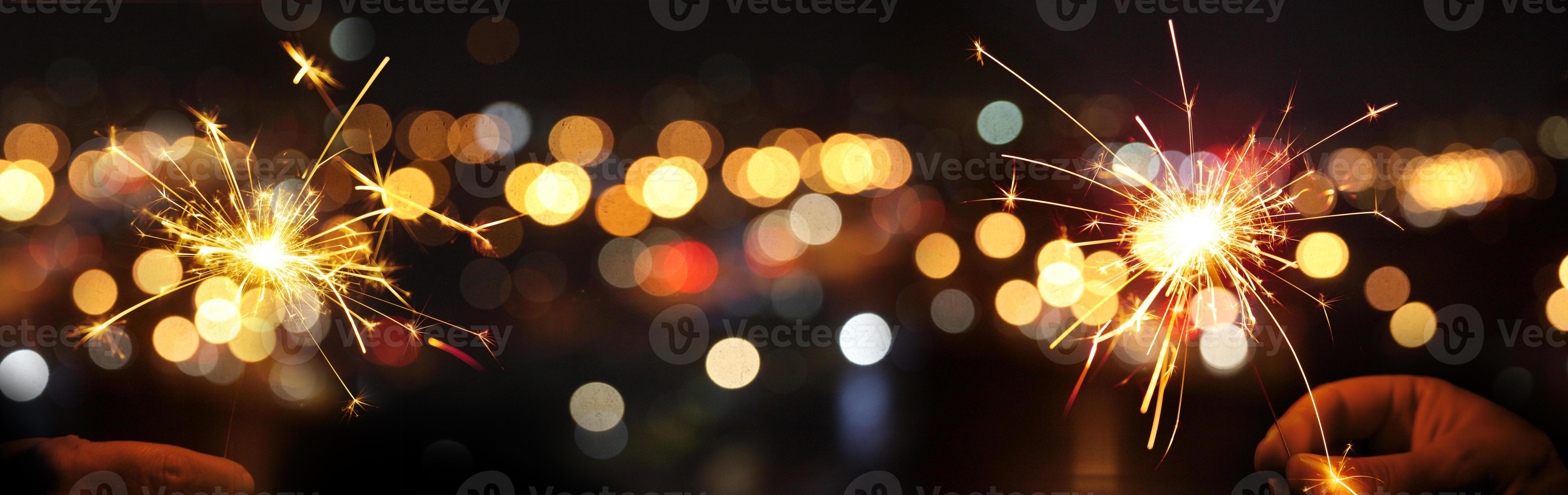 Happy New Year background with glowing sparklers. 16674545 Stock Photo