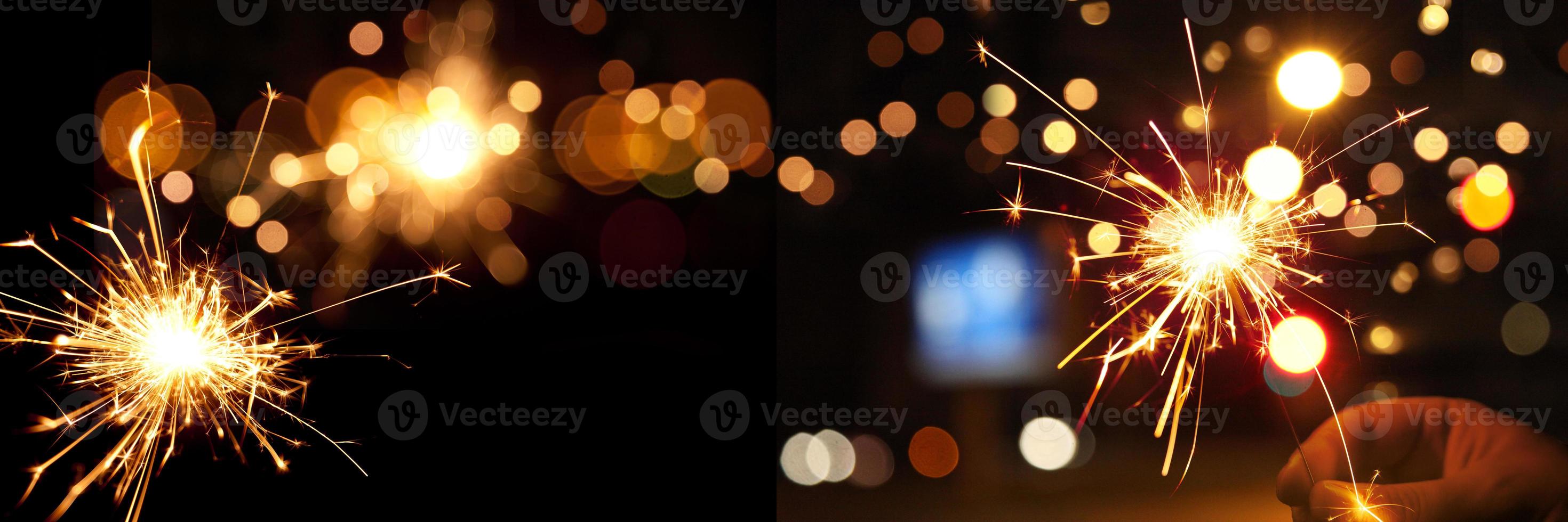 Happy New Year background with glowing sparklers. photo