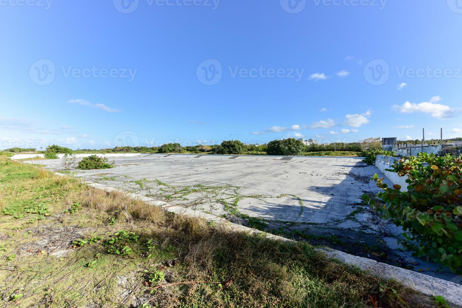 Old abandoned pool in Alamar, a district in the eastern part of Havana in Cuba. This district is primarily prefabrication construction of Soviet-style architecture. photo