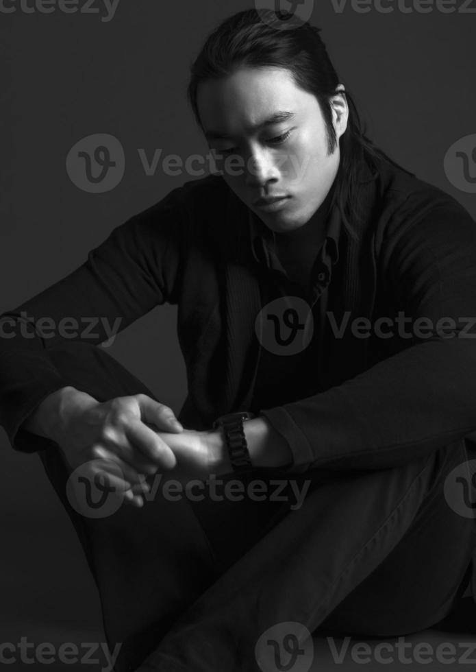 handsome asian fashion looking man posing in studio on black background, lifestyle modern people concept photo