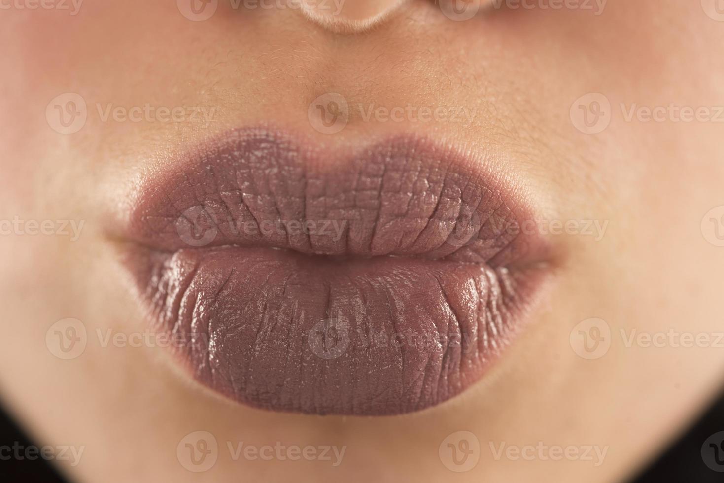 Makeup, lip makeup.Woman performs makeup, paints lips liner pencil photo