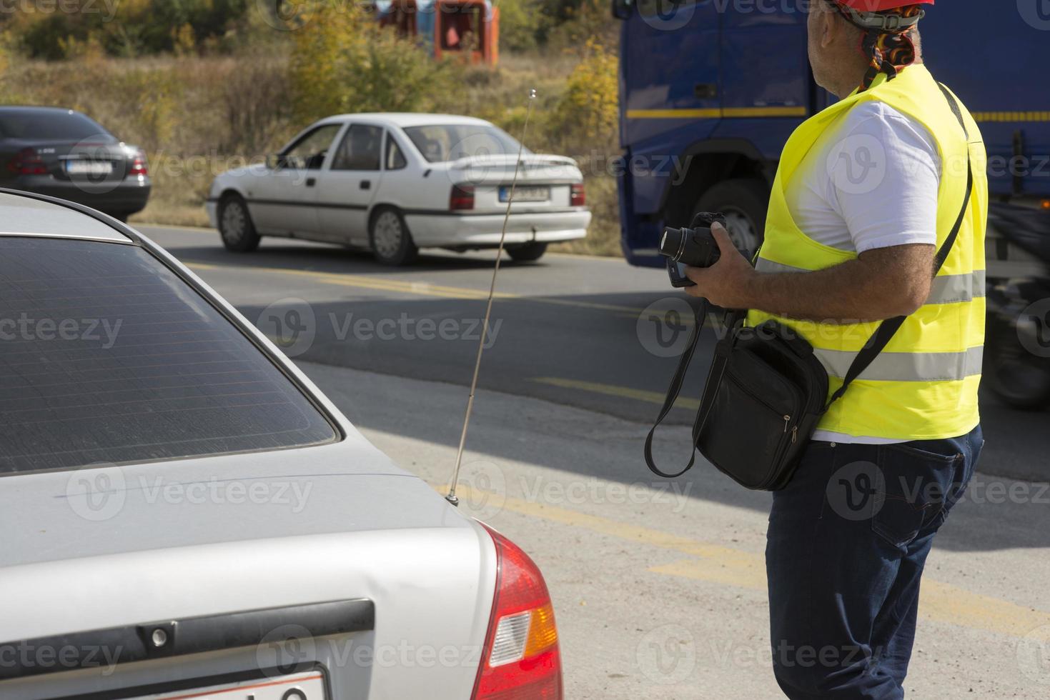 Surveyor engineer is measuring level on construction site. Surveyors ensure precise measurements before undertaking large construction projects. photo