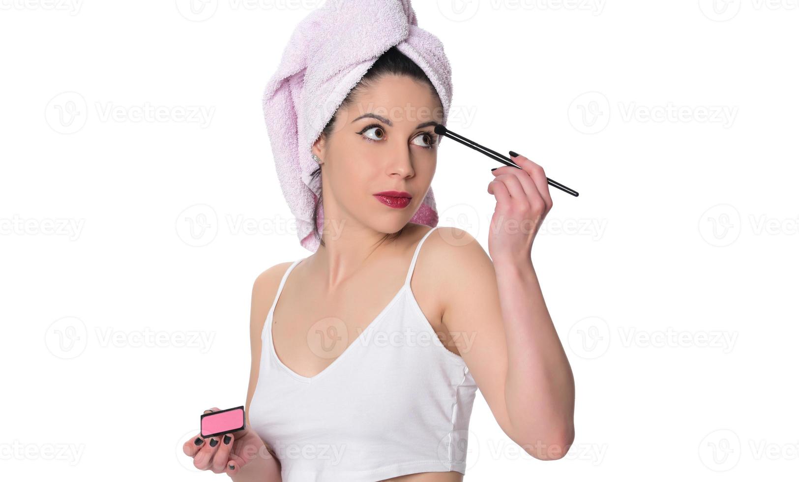 Facial Makeup. Closeup Of Beautiful Young Female Model Putting Blush With Cosmetic Brush. Portrait Of Attractive Healthy Girl With Pure Clean Skin And Natural Make-Up. Beauty Concept. High Resolution photo