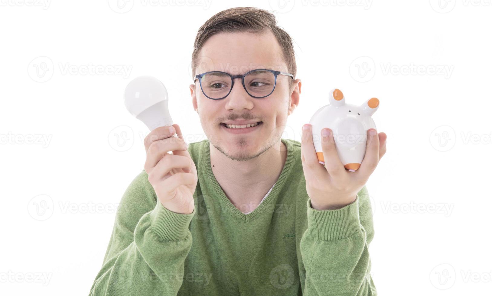 Saving electricity. Led light bulb and piggy bank, photo