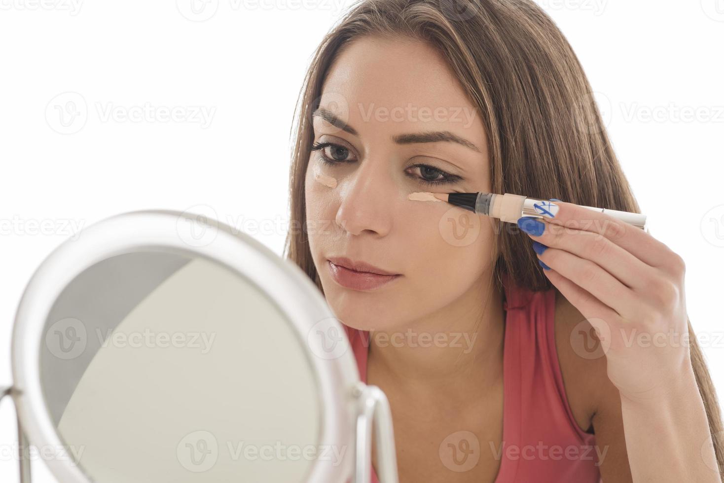 Beauty makeup woman smiling closeup. Beautiful young woman applying make up with blush photo