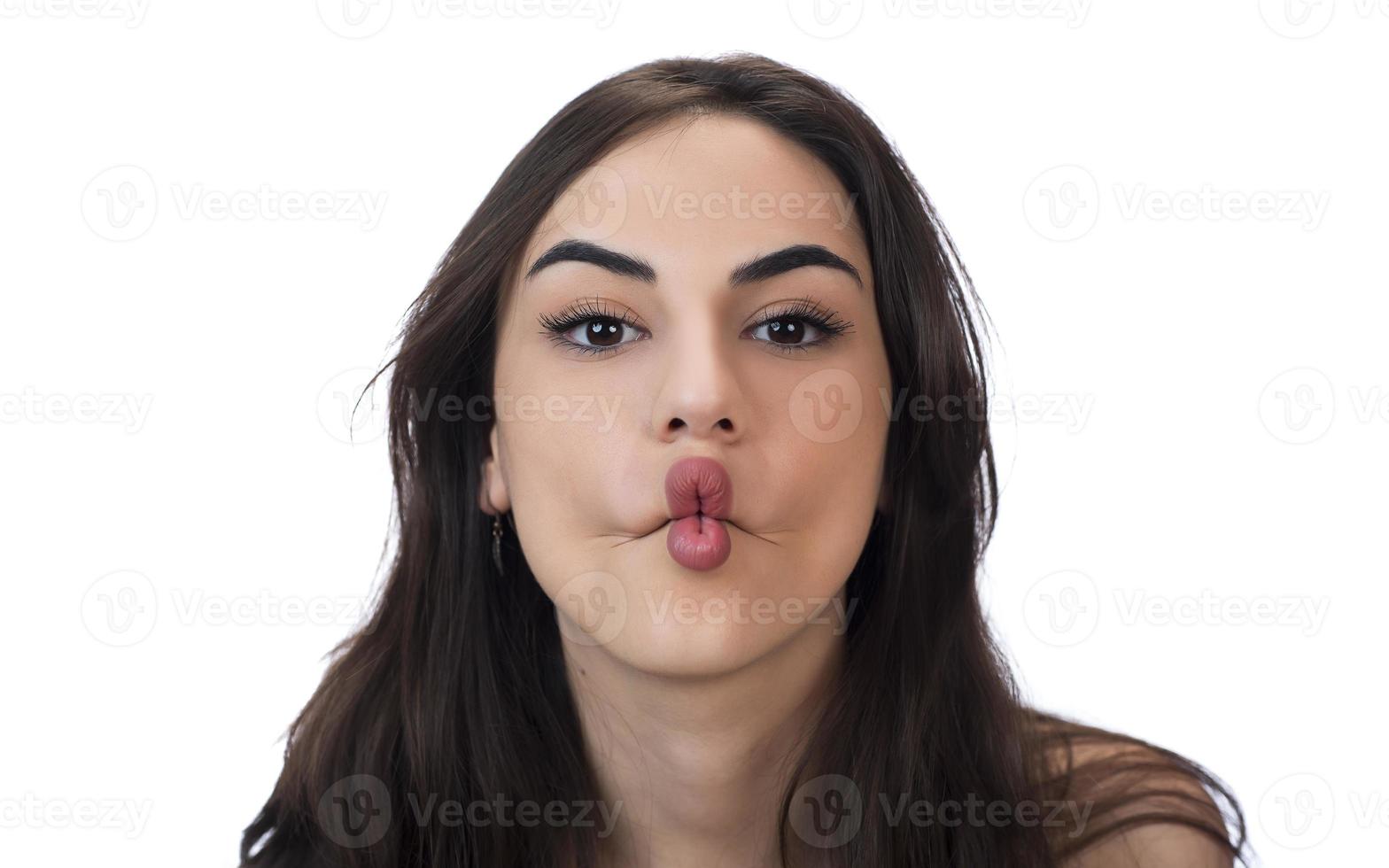 squint eyed woman with weird expression isolated on white photo