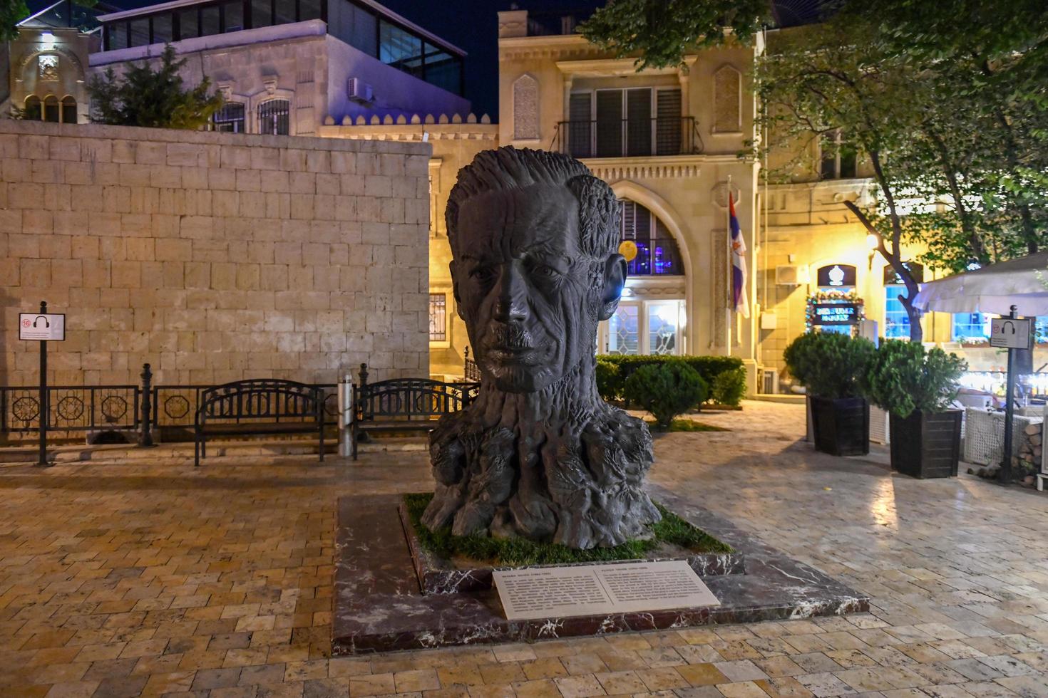 Baku, Azerbaijan - July 14, 2018 -  Sculpture head of Aliaga Vahid in Old City of Baku. Vahid was Azerbaijani poet, known for reintroducing medieval ghazel style in modern poetry. photo