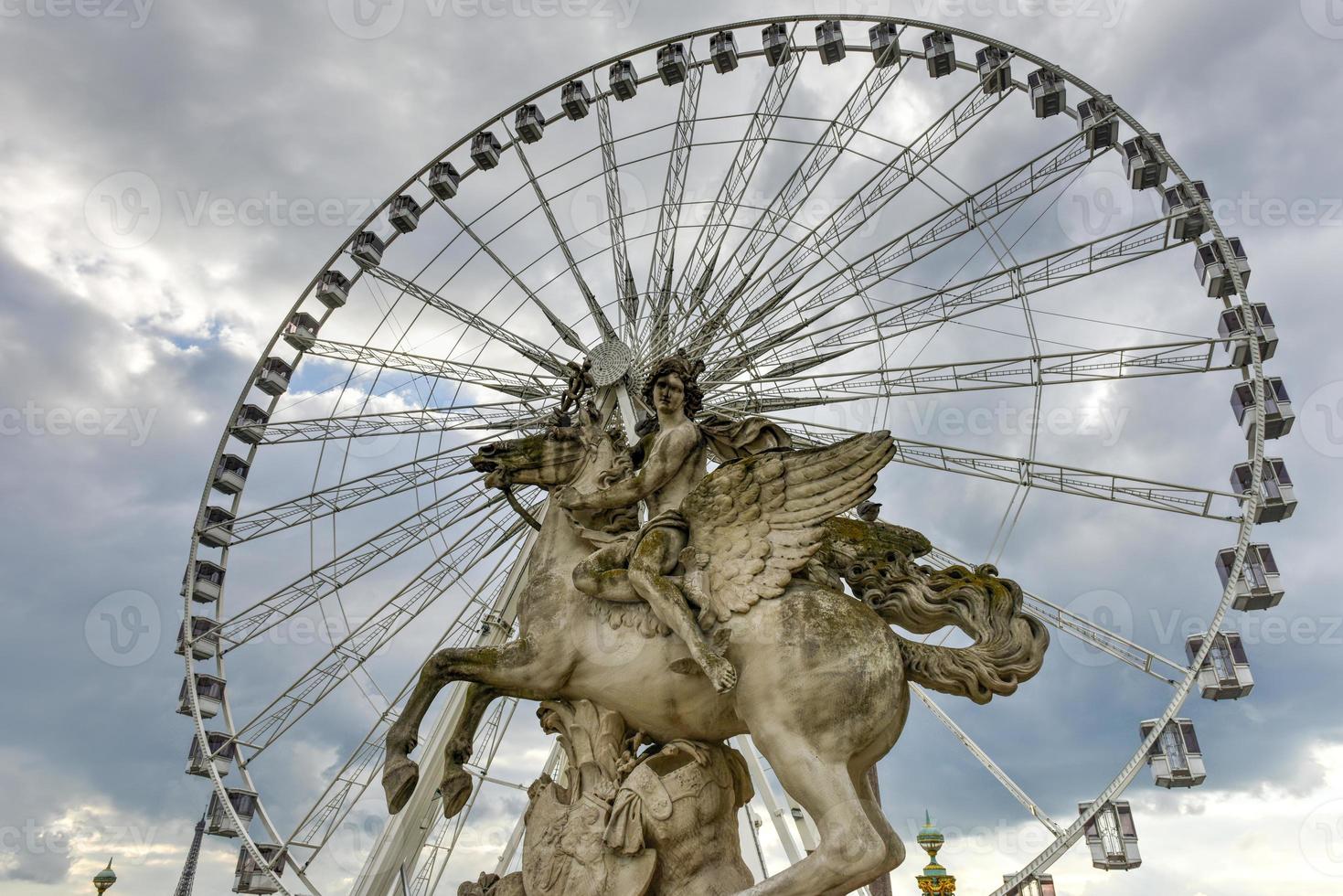 Ferris Wheel by Tuileries Garden in Paris, France. It is one of the oldest and most popular places in the center of Paris in the 1st district, on the right bank of Seine. photo