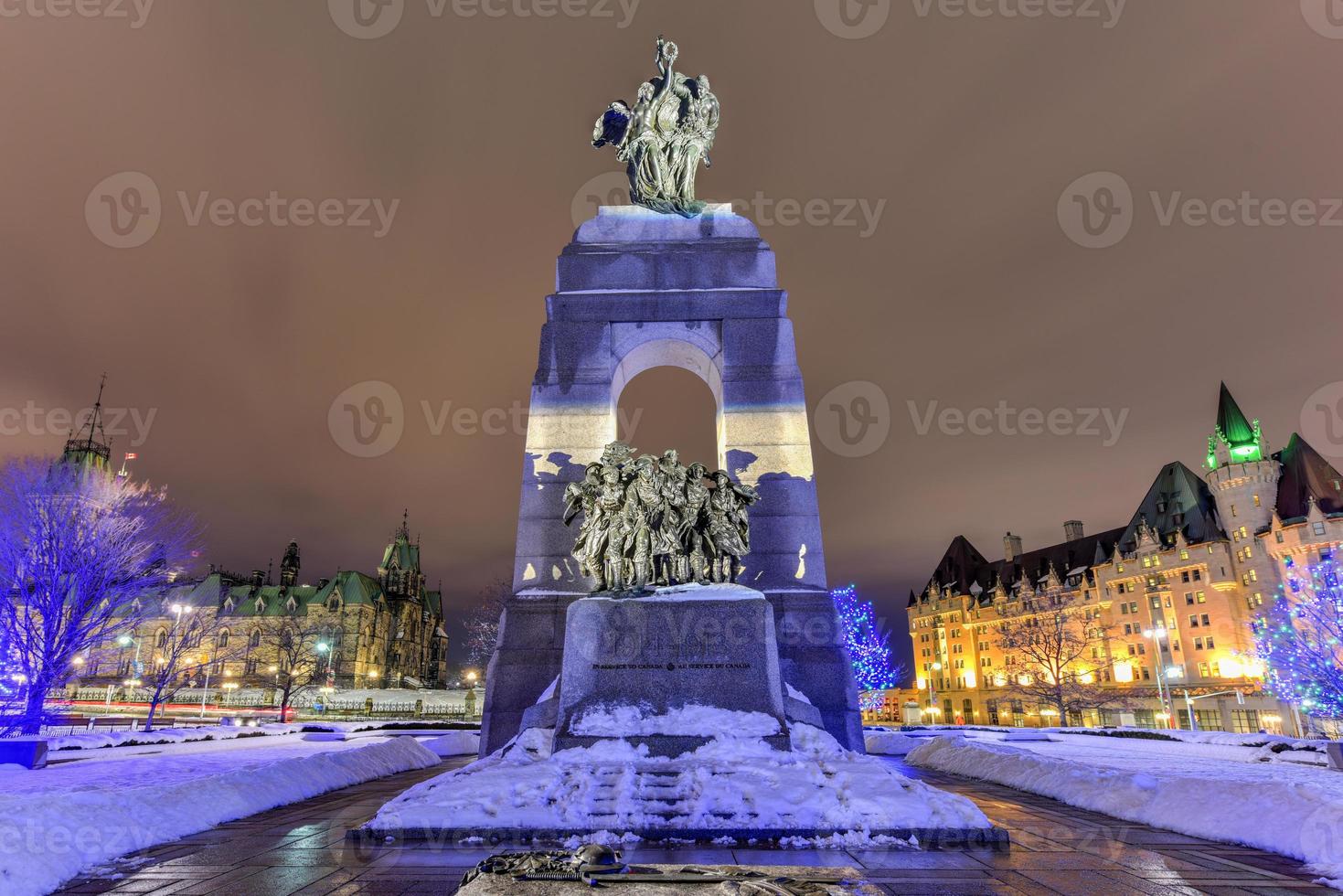 The National War Memorial, is a tall granite cenotaph with acreted bronze sculptures, that stands in Confederation Square in Ottawa, Ontario, Canada. photo