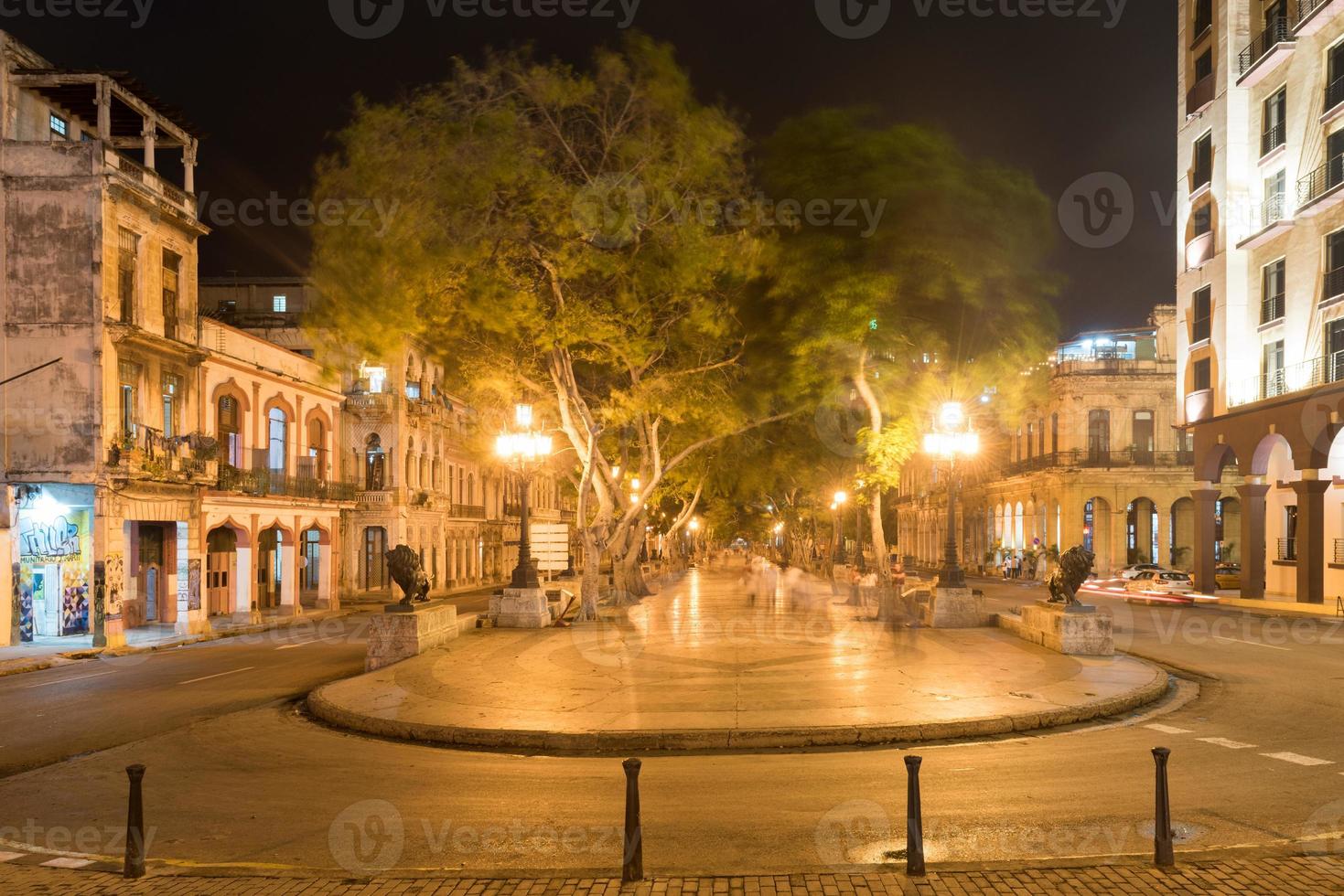 The wide boulevard Paseo del Prado in Havana, Cuba at night. photo