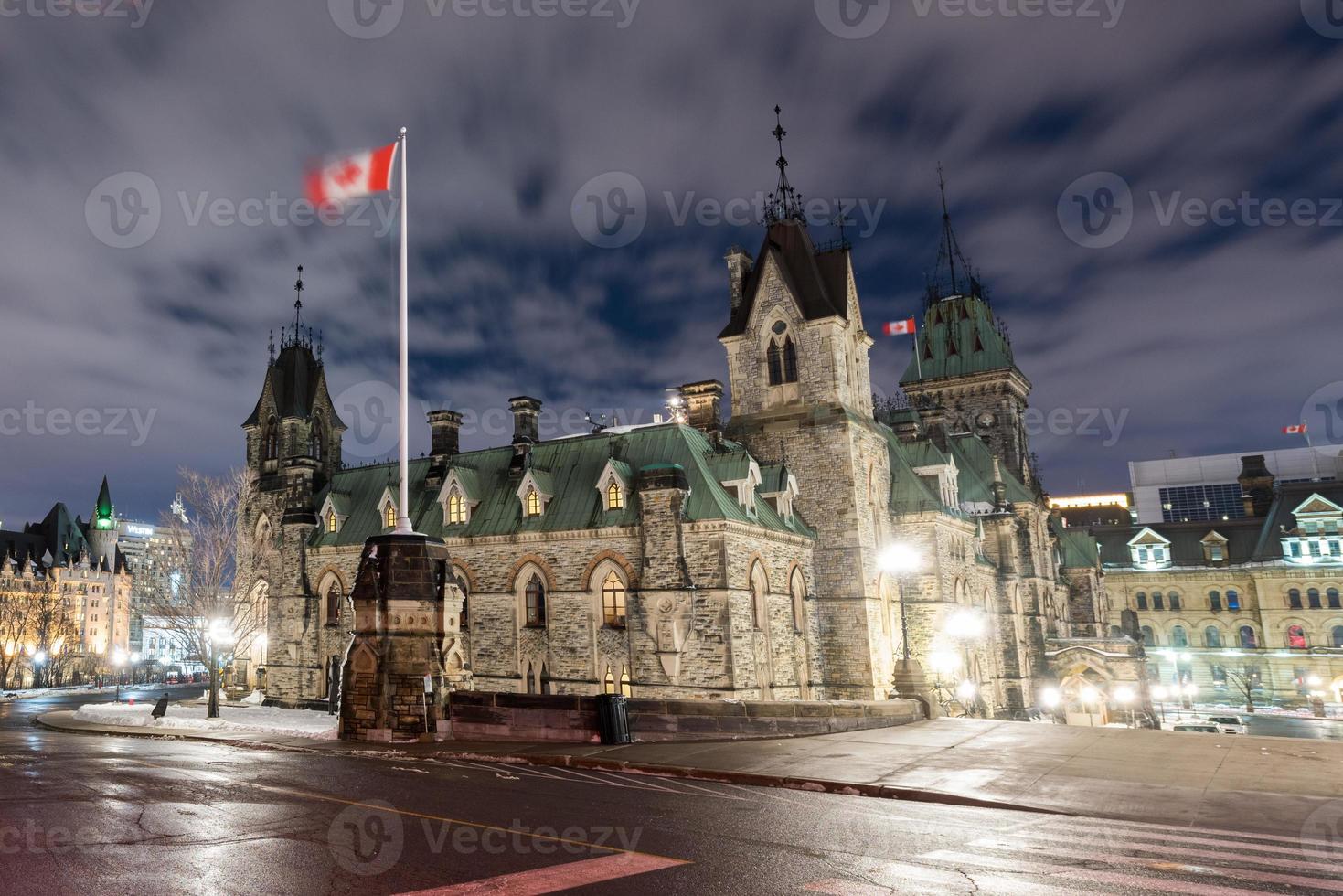 Parliament Hill and the Canadian House of Parliament in Ottawa, Canada during wintertime at night. photo