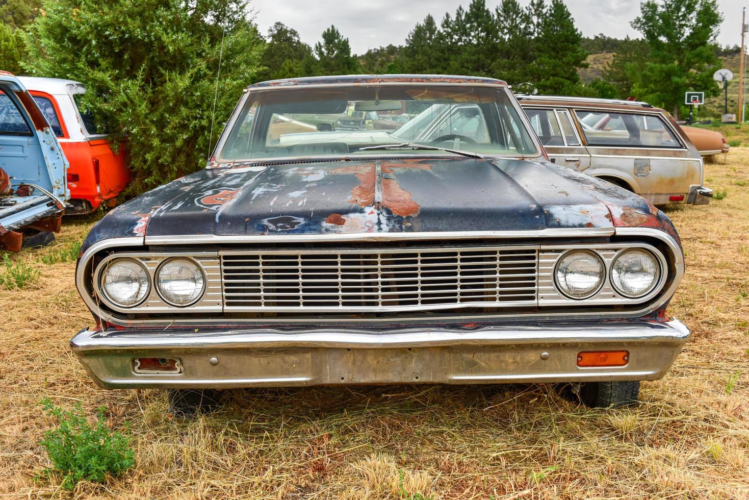 Rusting old car in a desert junk yard in Arizona, USA, 2022 photo