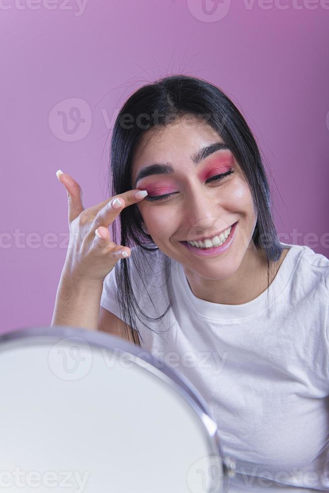 woman putting make up photo