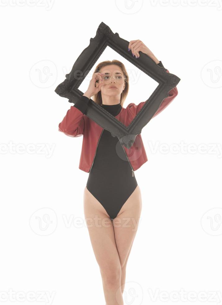 Fashionable young attractive woman posing in studio, wearing black sensual clothes photo