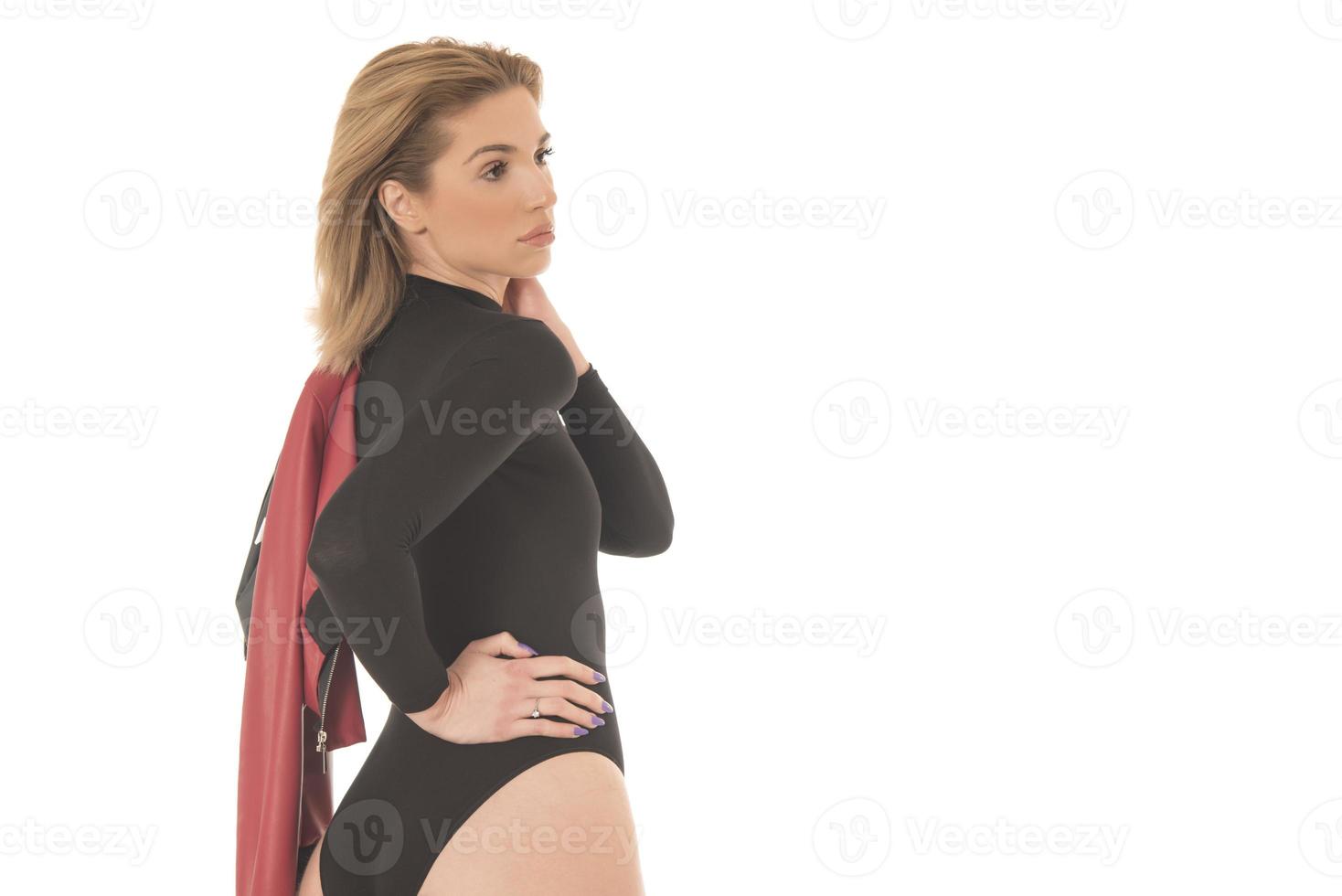 Fashionable young attractive woman posing in studio, wearing black sensual clothes photo