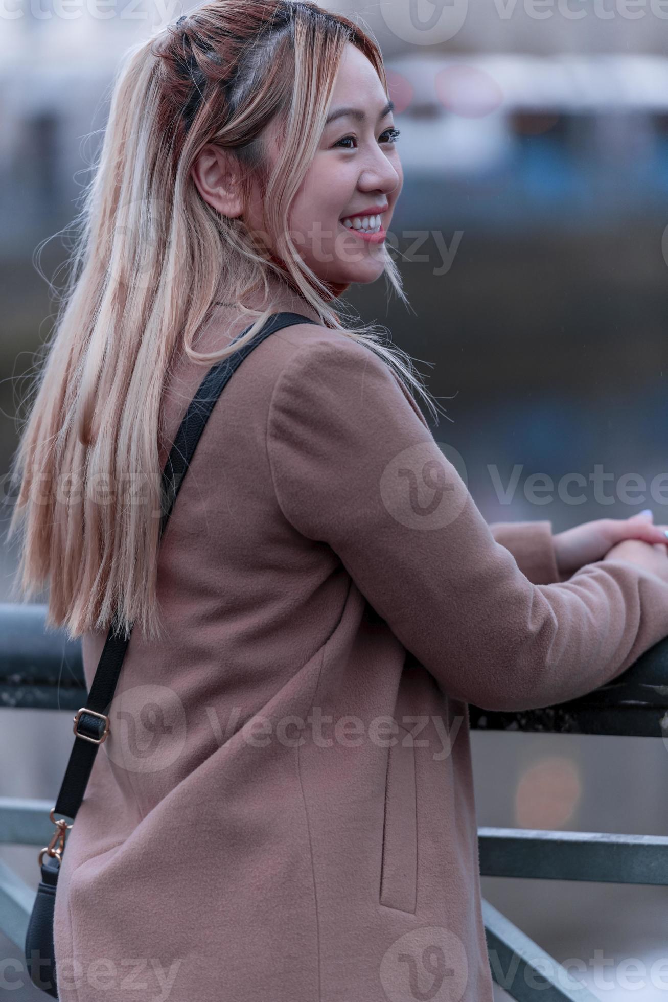 Outdoor portrait of young Asian beautiful fashionable happy woman. Model  posing outdoor. 16677313 Stock Photo at Vecteezy