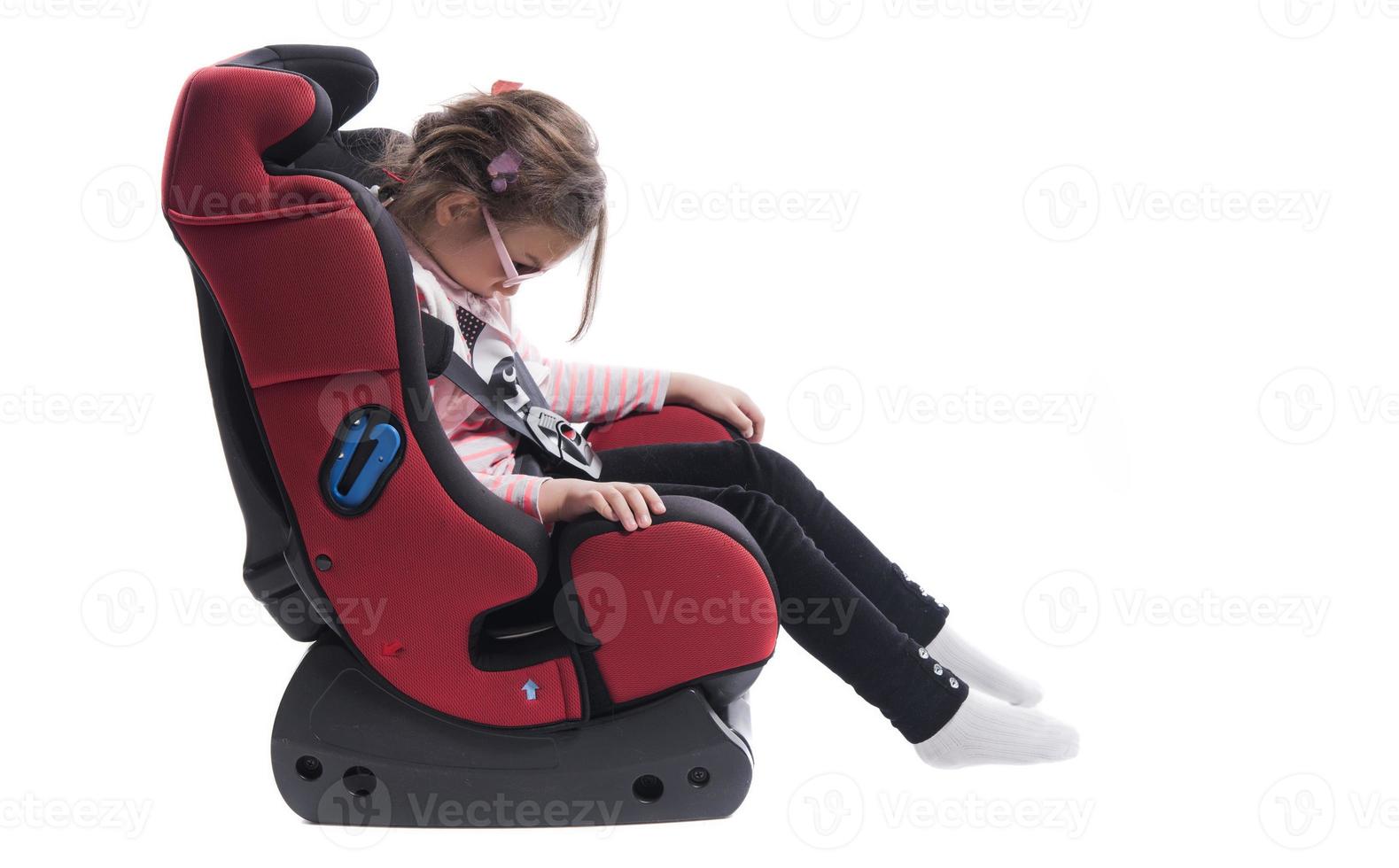 A little girl in a car seat photo