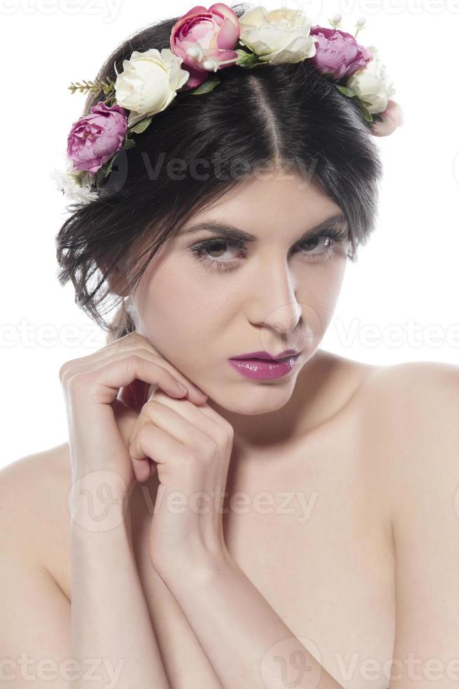 Portrait of young beautiful fresh girl with long hair and floral headband photo