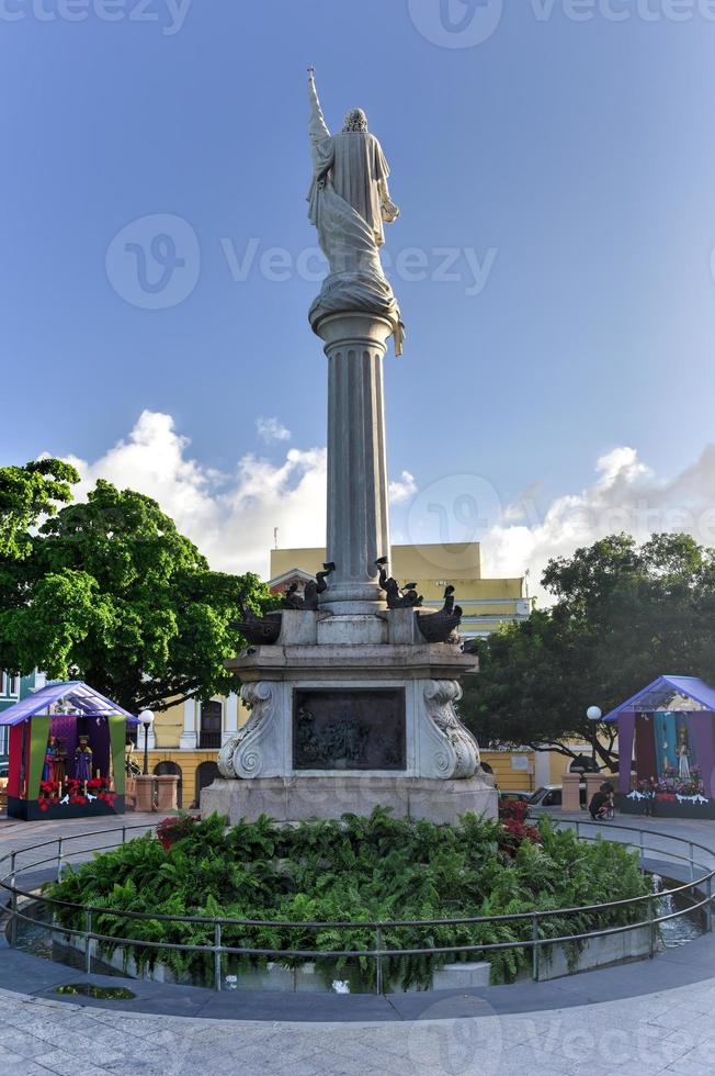 Plaza Colon in Old San Juan, Puerto Rico with a statue of Christopher Columbus. photo