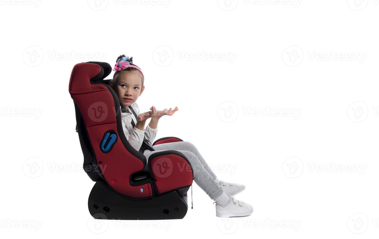 A little girl in a car seat photo