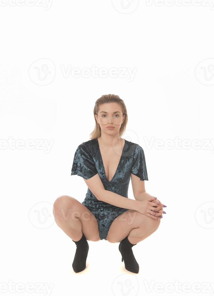 Fashionable young attractive woman posing in studio, wearing black sensual clothes photo