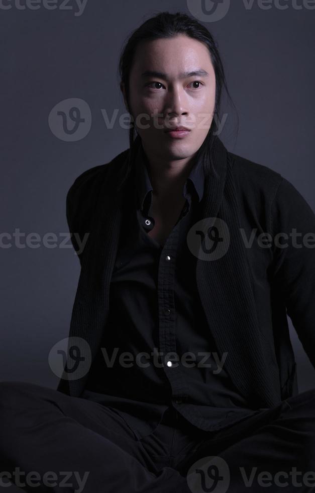 handsome asian fashion looking man posing in studio on black background, lifestyle modern people concept photo