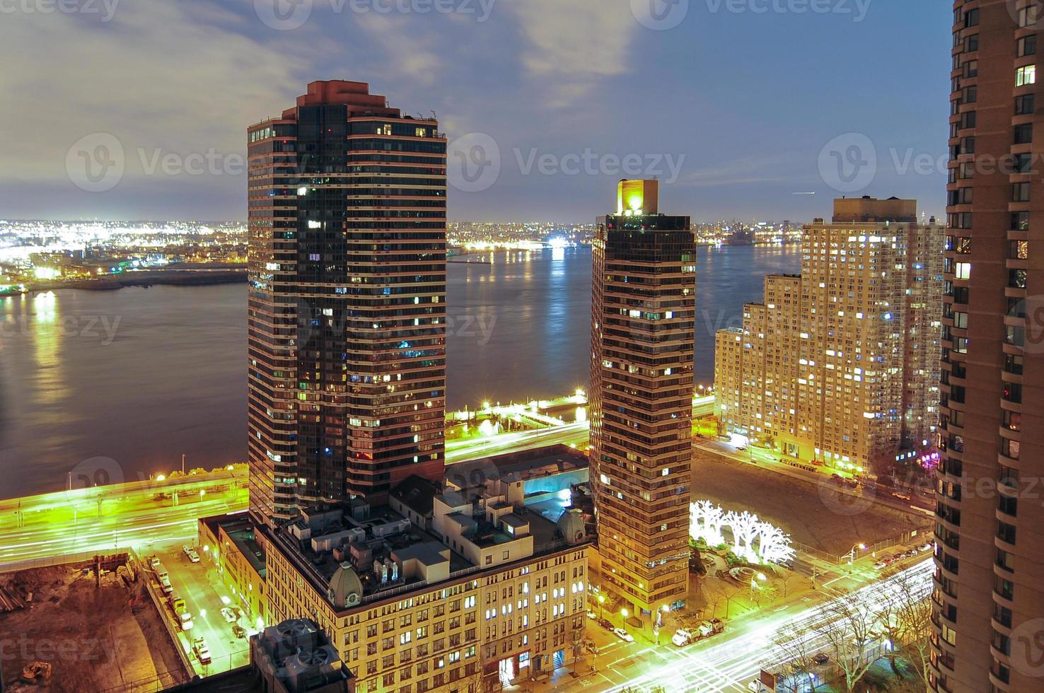 Aerial view along Midtown East in New York City at night. photo