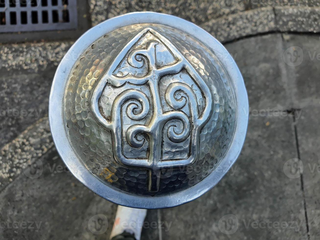Pedestrian facilities on the Malioboro sidewalks include steel pipe bollards with traditional ornaments or motifs photo