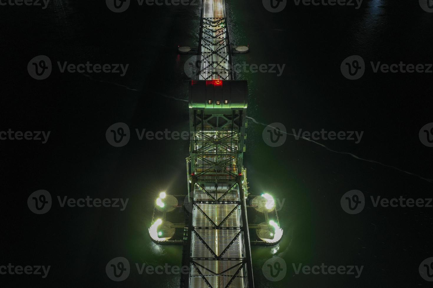 Marine Parkway-Gil Hodges Memorial Bridge as seen from Rockaway, Queens at night. Built and opened in 1937, it was the longest vertical-lift span in the world for automobiles. photo