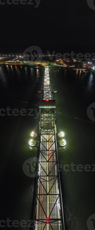 Marine Parkway-Gil Hodges Memorial Bridge as seen from Rockaway, Queens at night. Built and opened in 1937, it was the longest vertical-lift span in the world for automobiles. photo