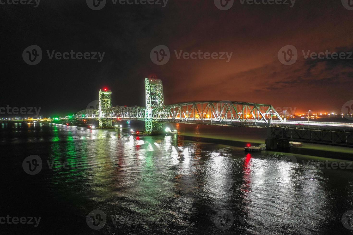 Marine Parkway-Gil Hodges Memorial Bridge as seen from Rockaway, Queens at night. Built and opened in 1937, it was the longest vertical-lift span in the world for automobiles. photo