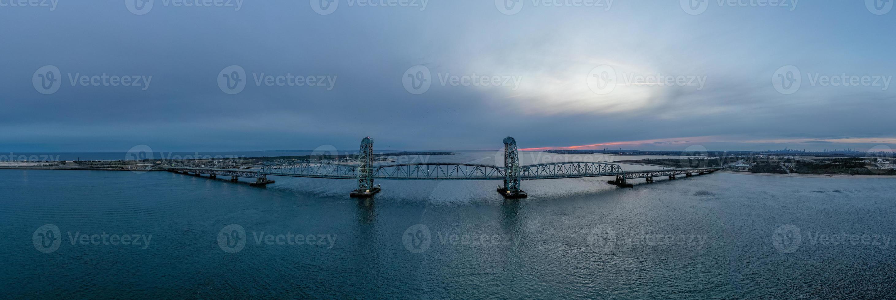 Marine Parkway-Gil Hodges Memorial Bridge as seen from Rockaway, Queens at dusk. Built and opened in 1937, it was the longest vertical-lift span in the world for automobiles. photo